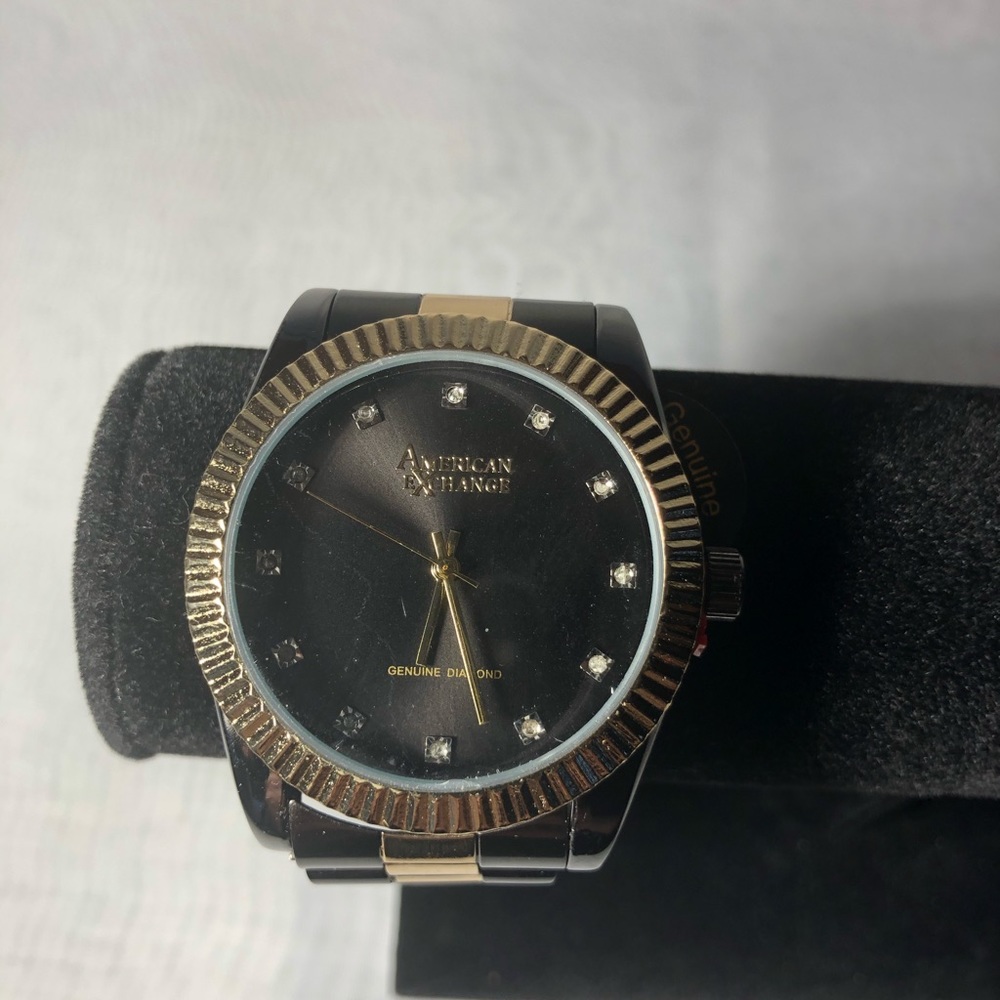 American exchange black and gold watch